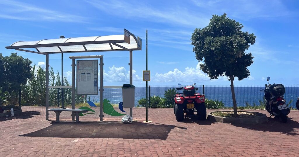 The bus stop outside of Doca do Cavacas with an ocean view.