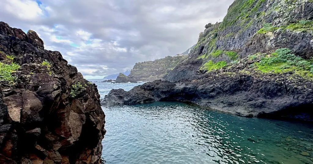 A natural pool in Seixal overlooks green cliffs on the north coast of Madeira.